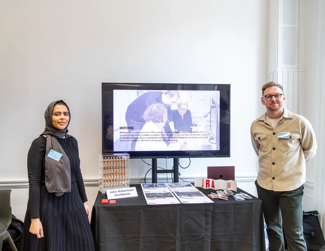 Architect talking to students