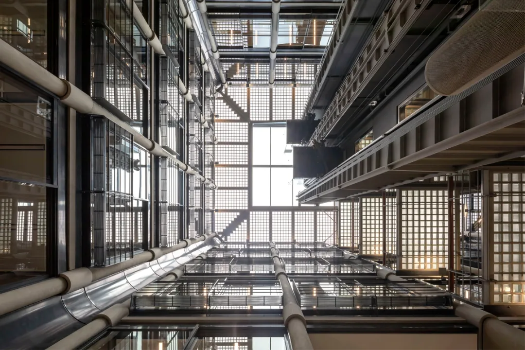 Looking up at large newly refurbished atrium with interior gantries