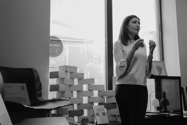 person talking next to exhibition