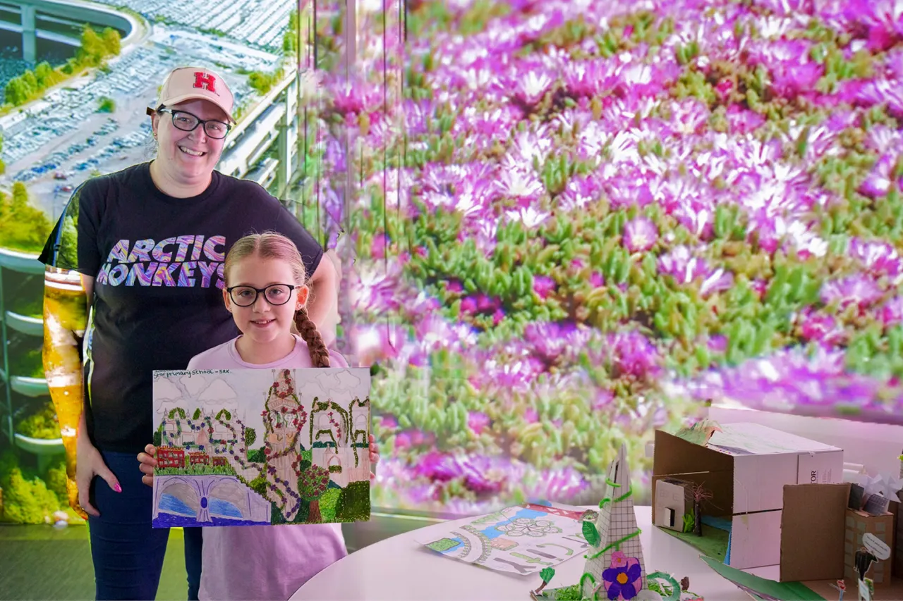 Pupil with her teacher showing her drawing surrounded by flowers
