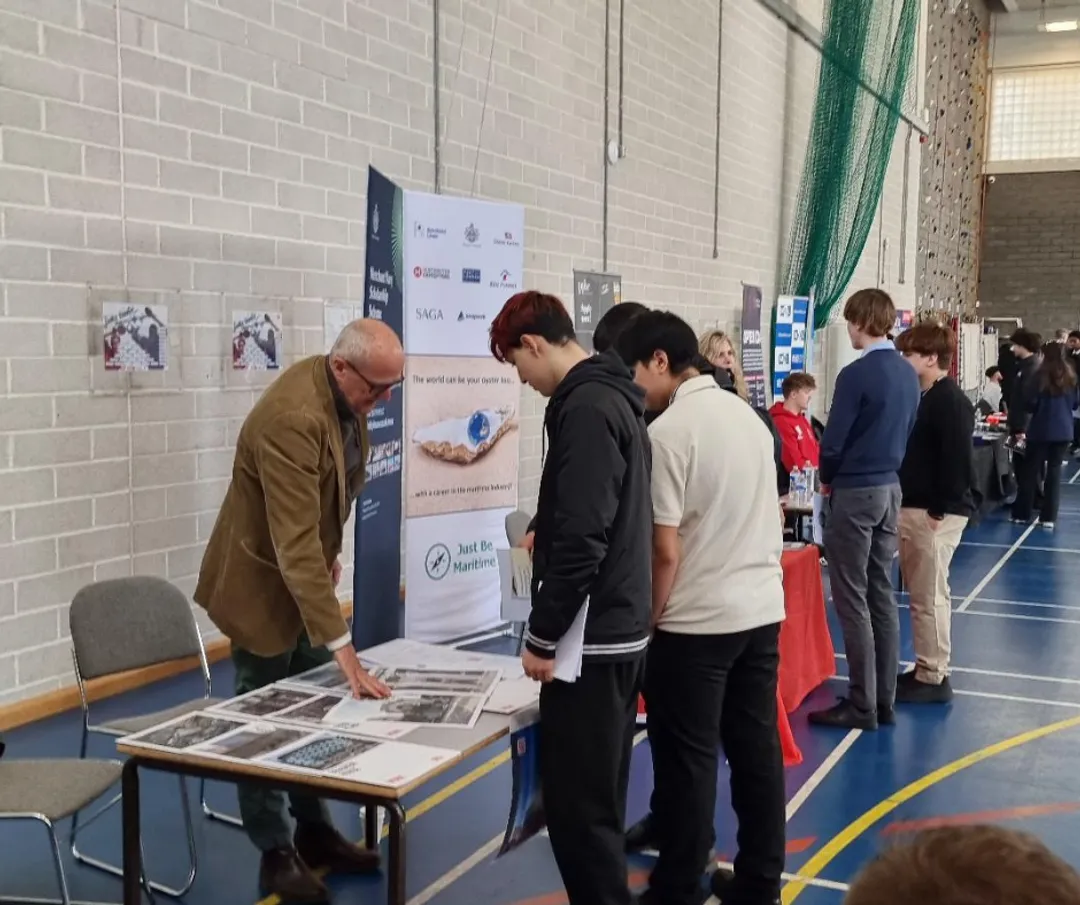 Mark handing out leaflets to students
