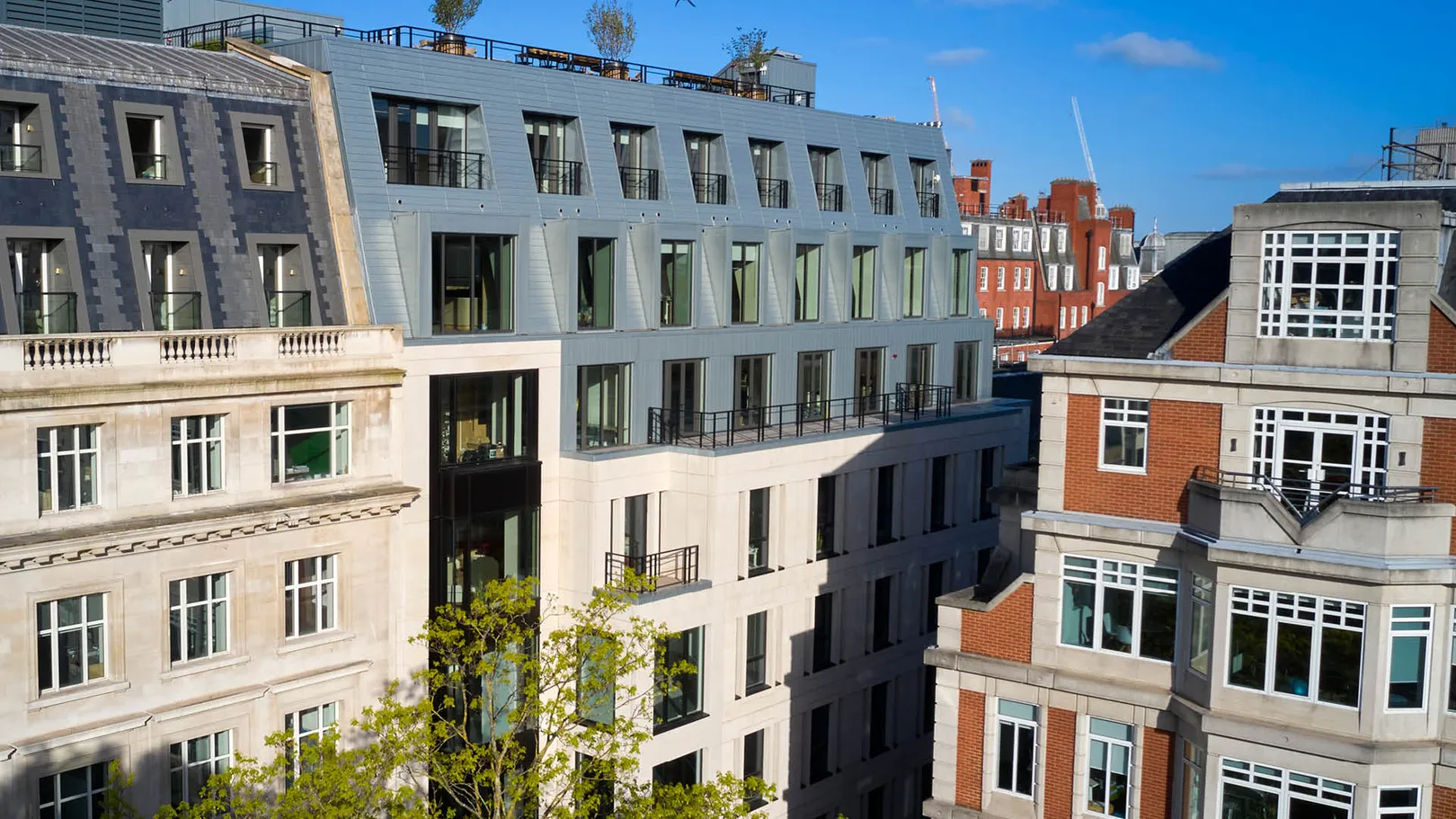 High level view of three storey mansard roof with Portland Stone beneath