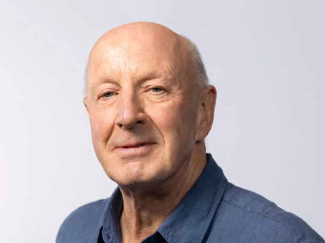 Portrait of person in blue shirt