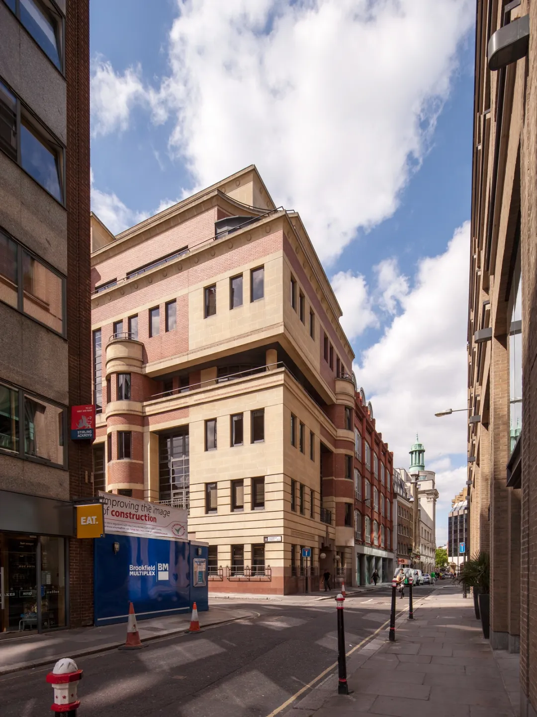 image of yellow building in corner from street