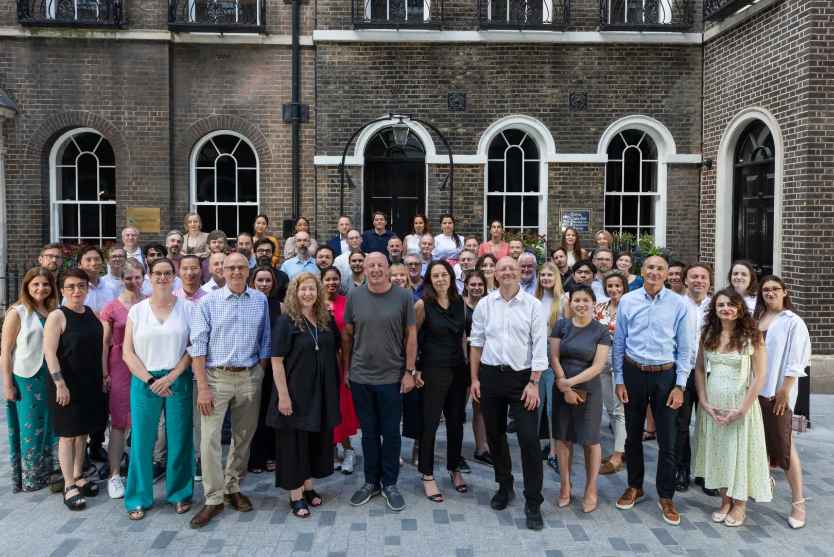 Group photograph of JRA team outside Georgian building