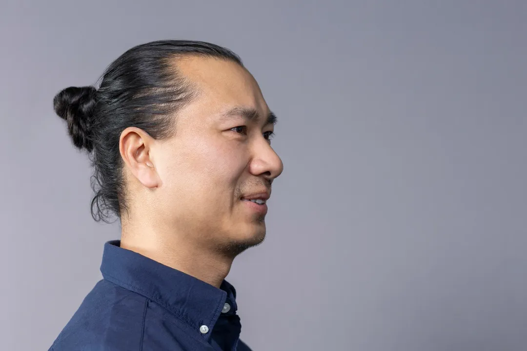 Portrait of man in navy shirt