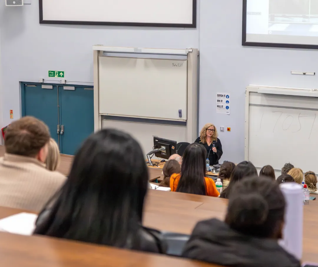 Etain giving lecture to students