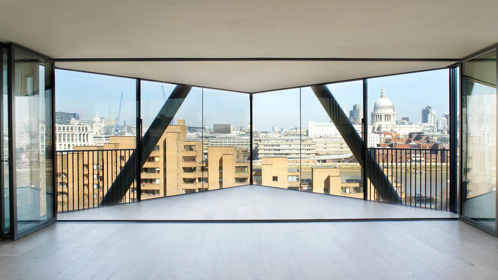 Empty apartment with full length glass walls overlooking Southbank and St Paul's Cathedral 