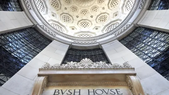 View from below Bush House entrance looking up at domed entrance with doric columns