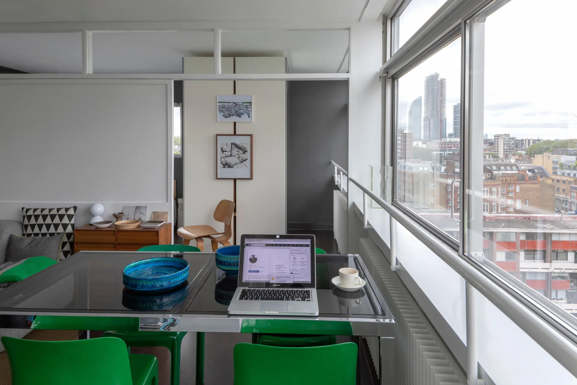 interior of home with desk and green chairs