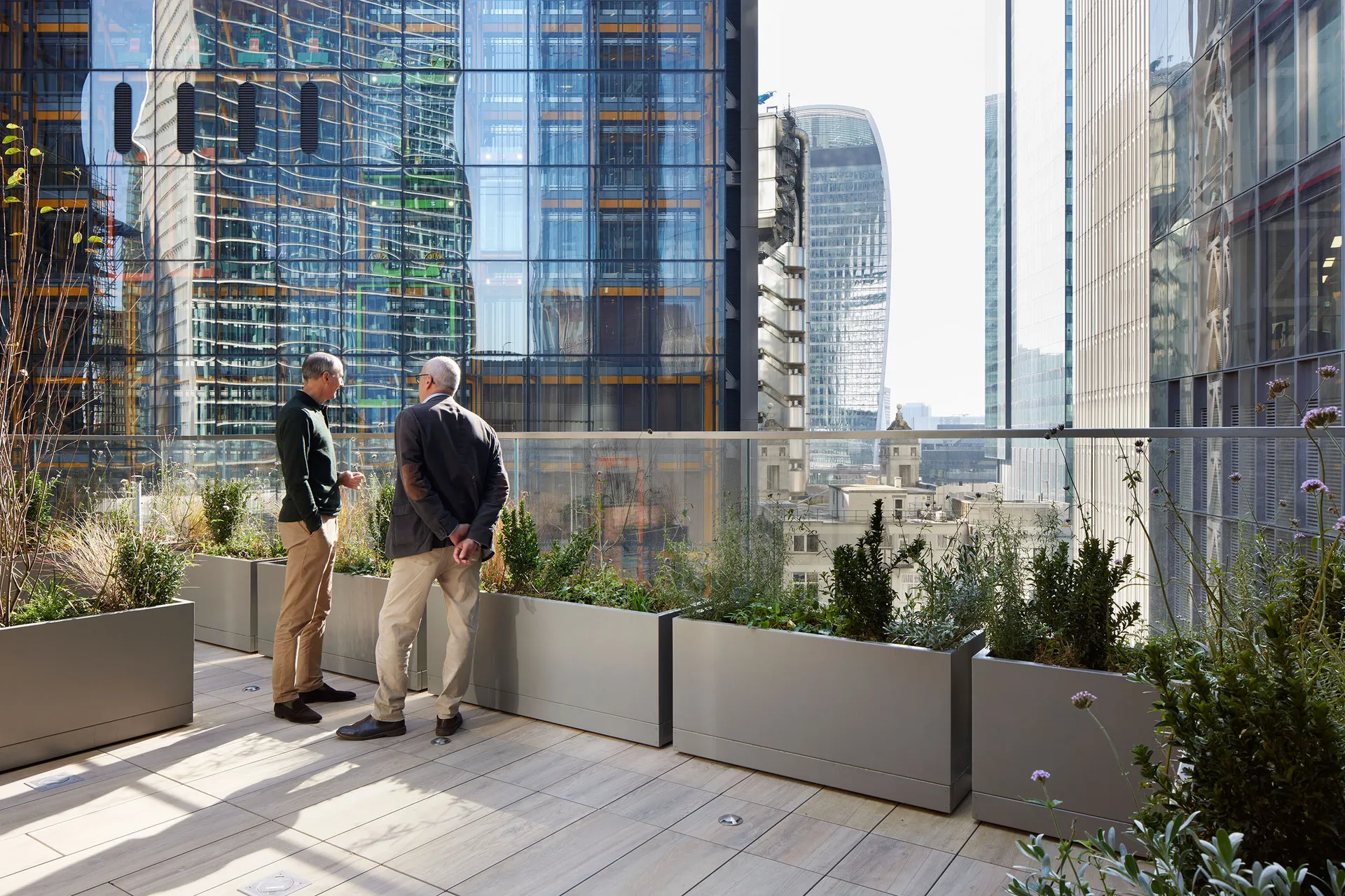 two men on terrace looking out at the view