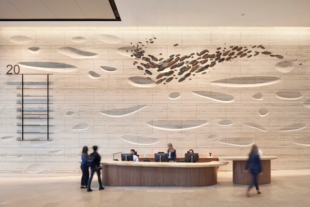 Photograph of people at reception desk
