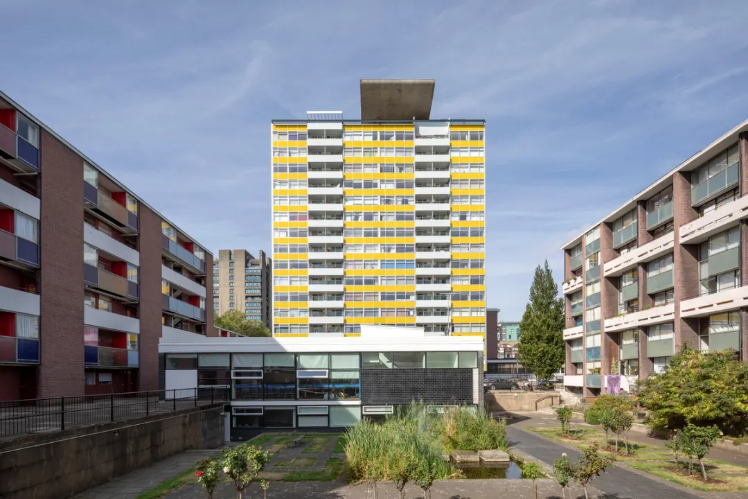 view of yellow and white building in estate