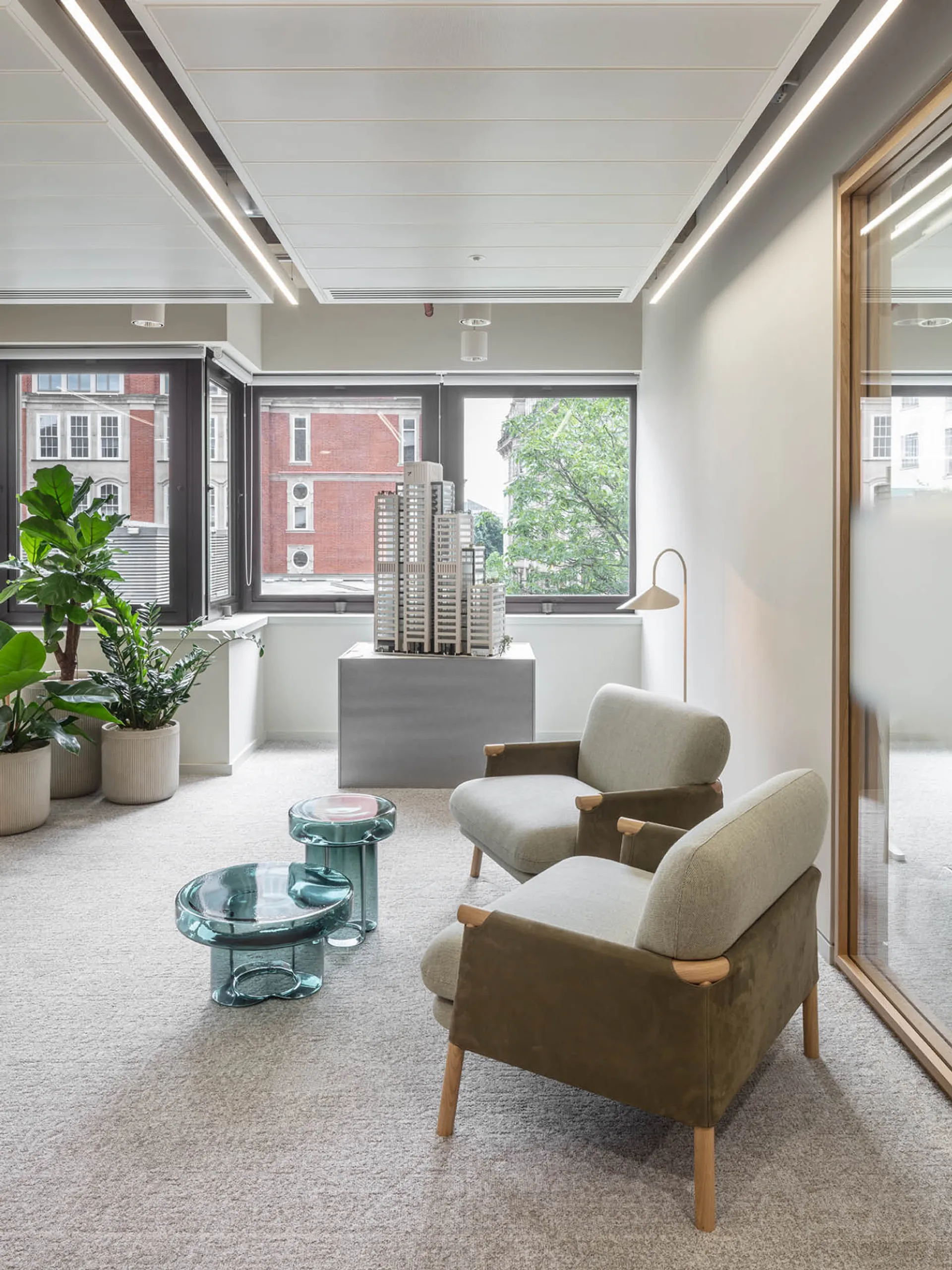 Two chairs in the corner of an office