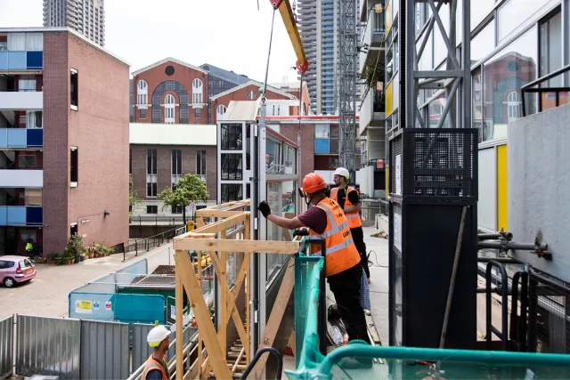 under construction workers dressed in orange