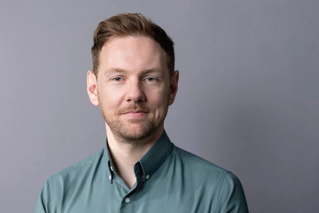 Portrait of man in green shirt