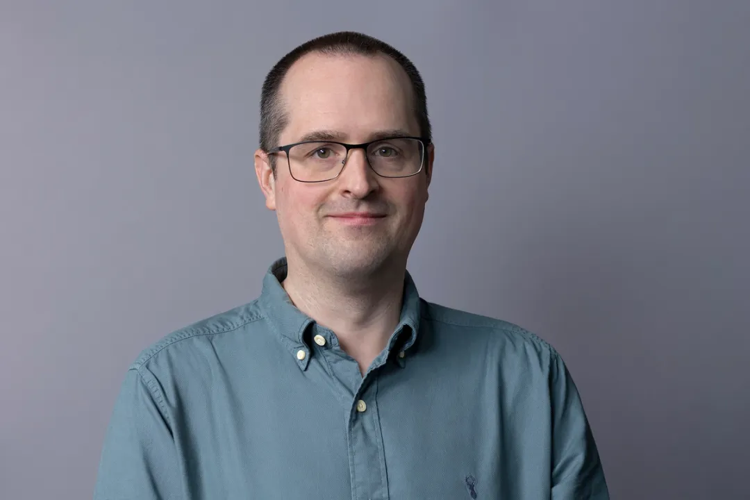 Portrait of man in green shirt