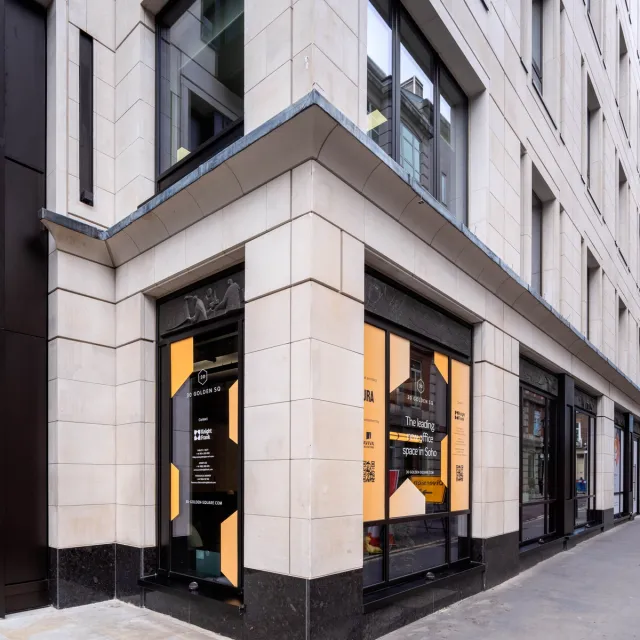 Corner close up of beige stone building