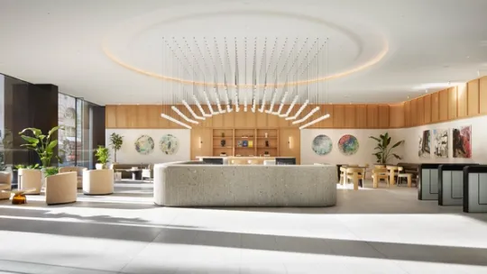 Photograph of the reception desk with coffee bar and seating in the background