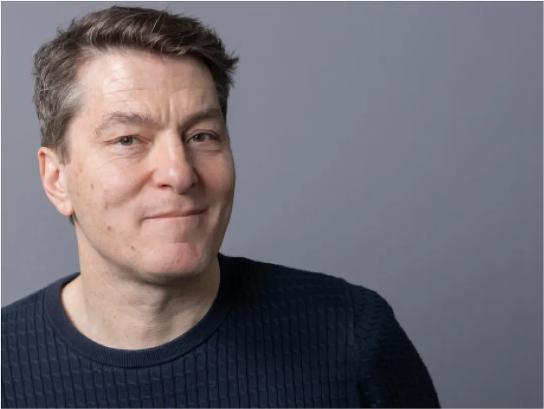 Portrait of person in dark blue top