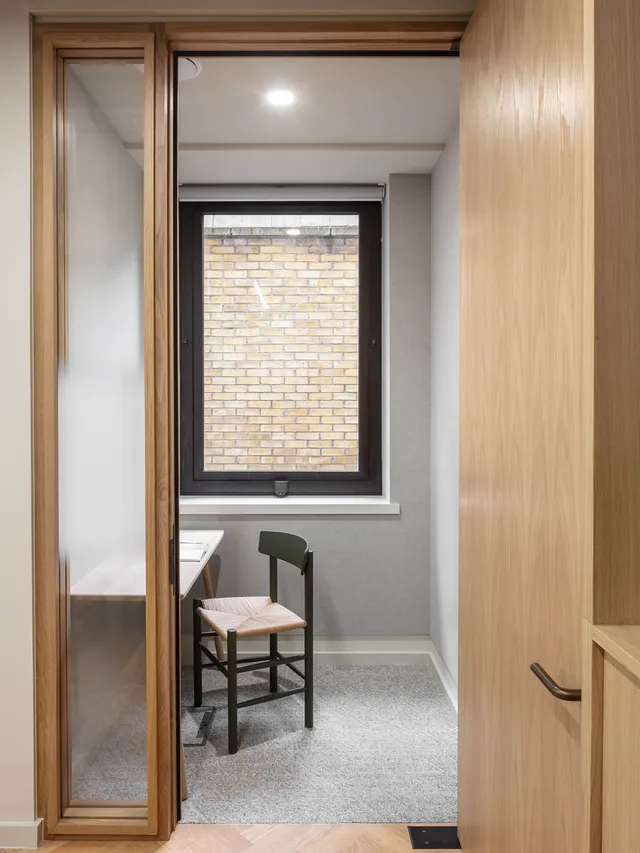 Desk chair and desk in small office room