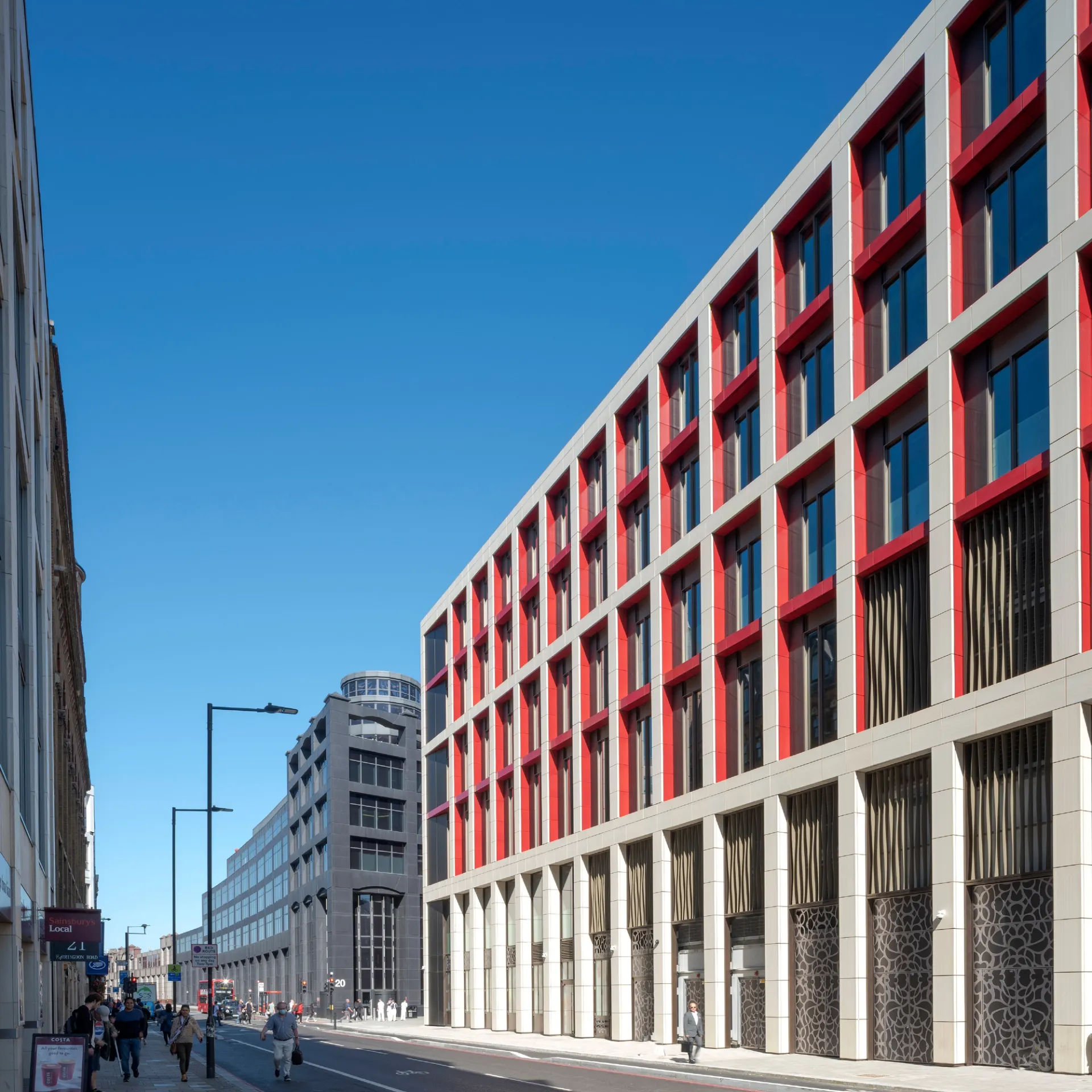 Street view of building with blue sky and surrounding area in Farringdon