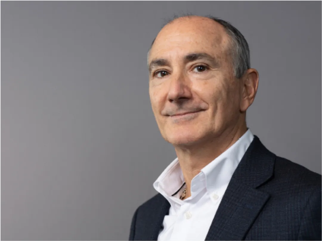 Portrait of person in white shirt and black jacket