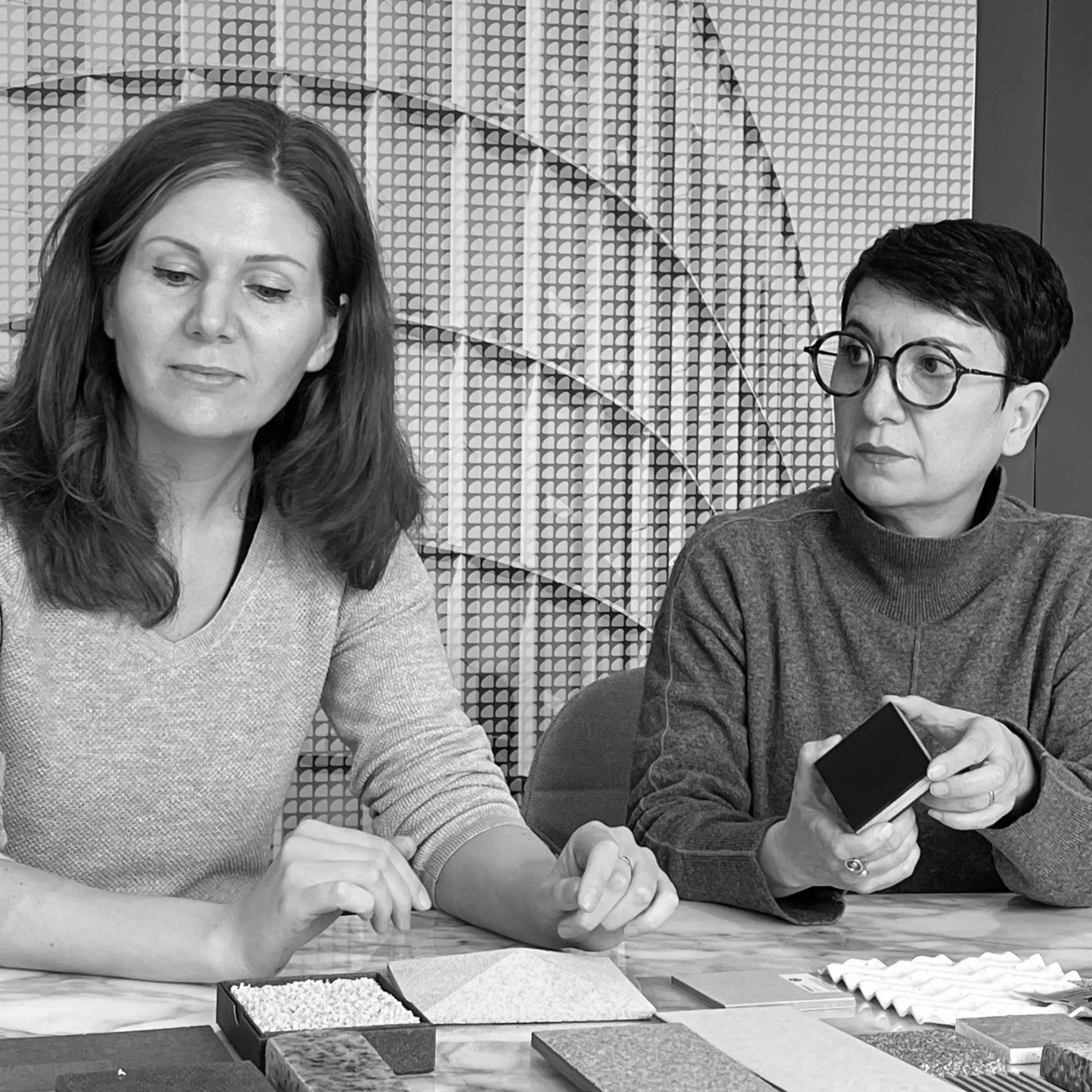 people looking at materials