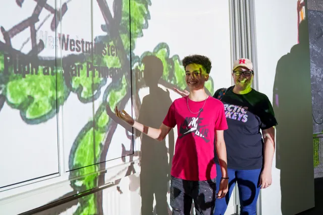 People interacting with video installation