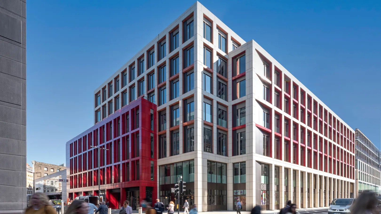 Three quarter view of Bloom Farringdon building with blurred people crossing the road
