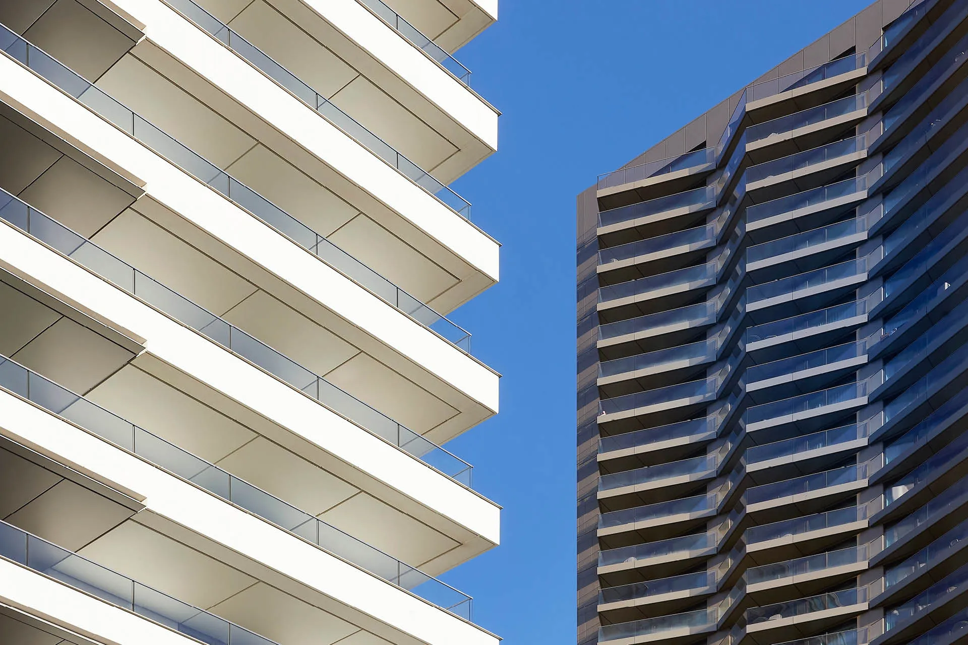 Close up corner view of white tower balconies