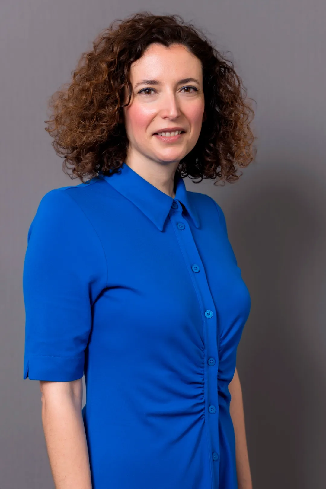 Women smiling in blue shirt