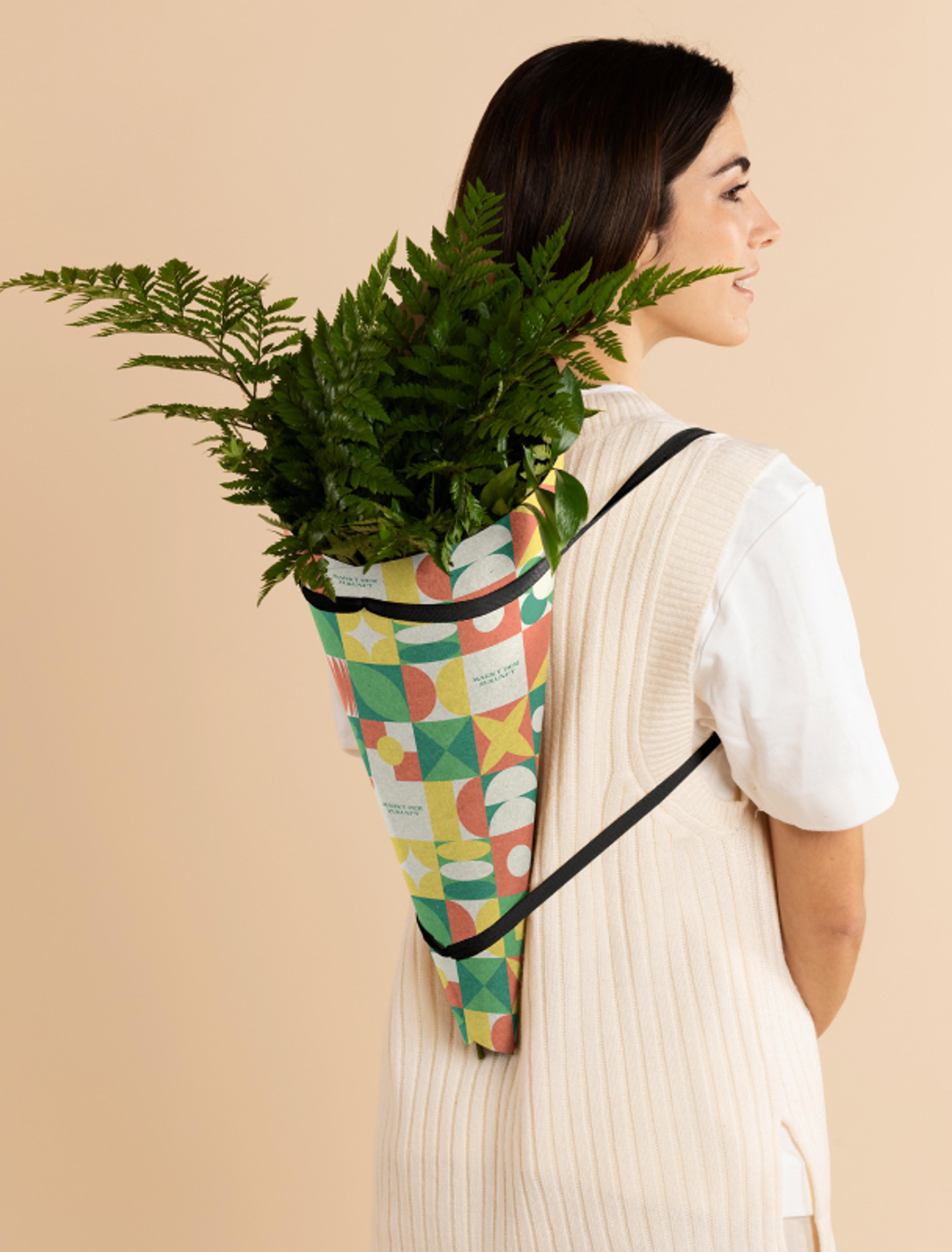 Nachhaltiges Pflanzen-Design für den Markt der Zukunft, gestaltet von Unerwartet in Graz. Moderne Trage mit bunten Mustern und umweltfreundlichem Fokus.