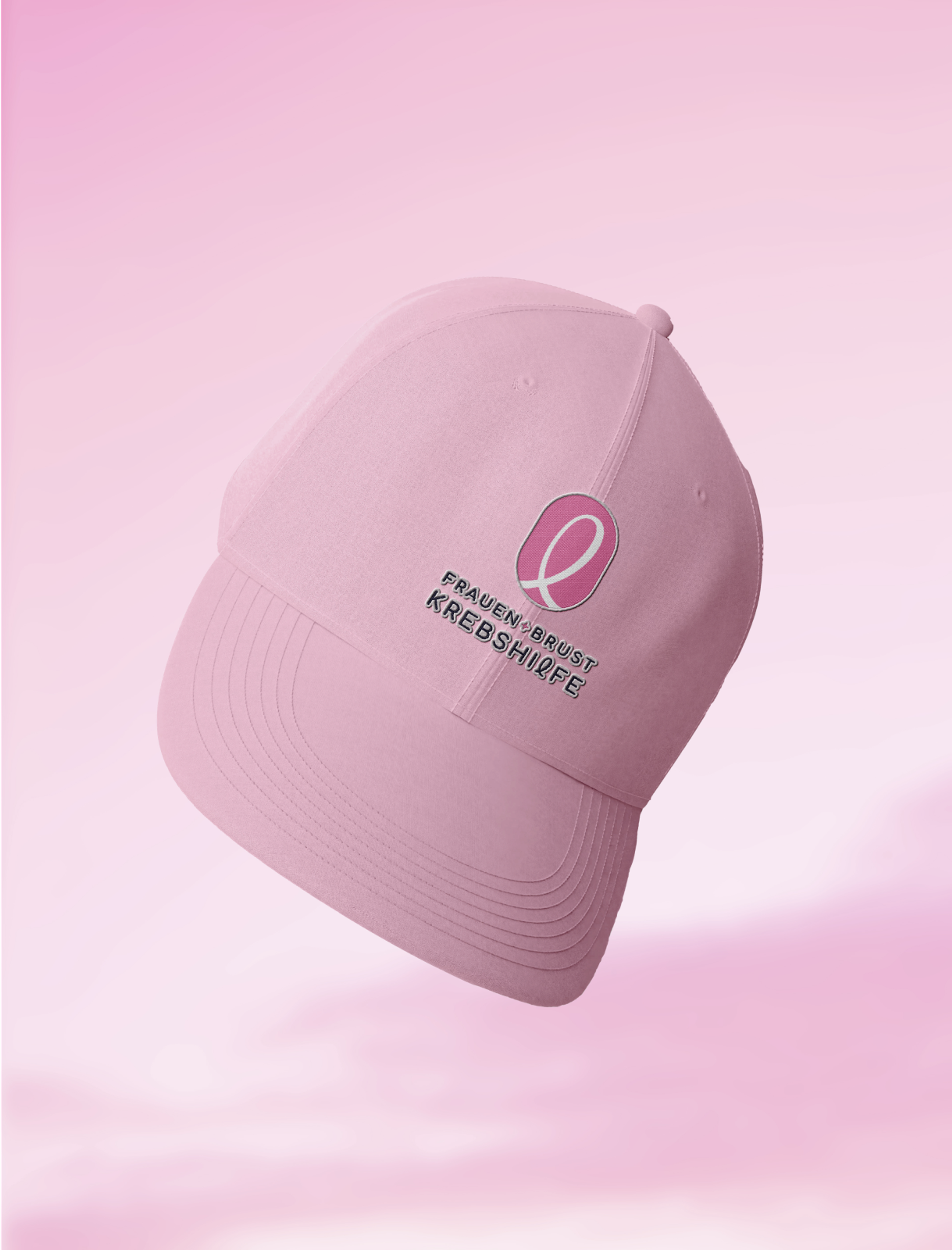 Sportliche Kappe in zartem Rosa mit dem Logo der Frauen- und Brustkrebshilfe Steiermark, designed von Unerwartet Design.
