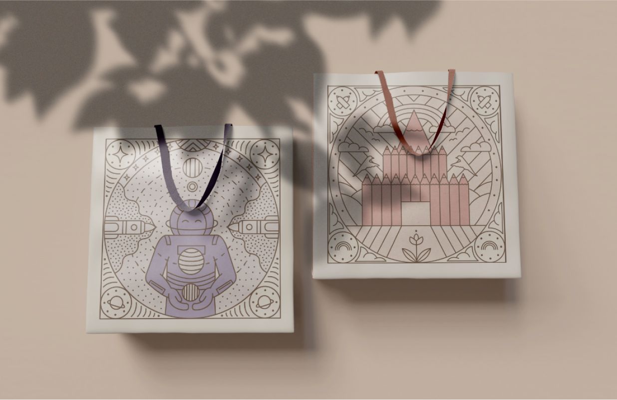 Lorato Schokoladengeschenktüten mit filigranen Illustrationen – Astronauten- und Schlossmotiv. Luxuriöses, nachhaltiges Verpackungsdesign.