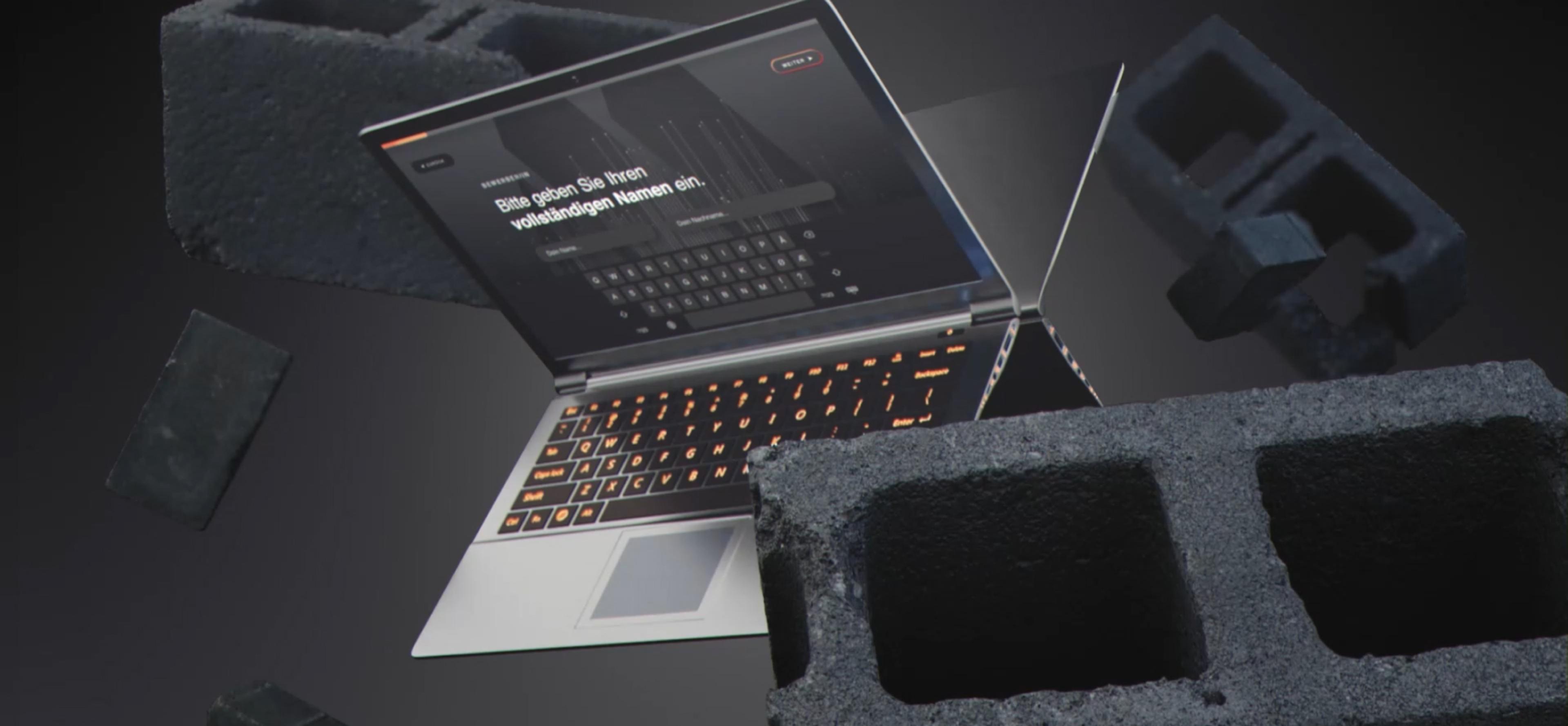 Laptop öffnet sich und zeit das UI Design von Magna Eingangsportal Webseite, gestaltet von Unerwartet Design