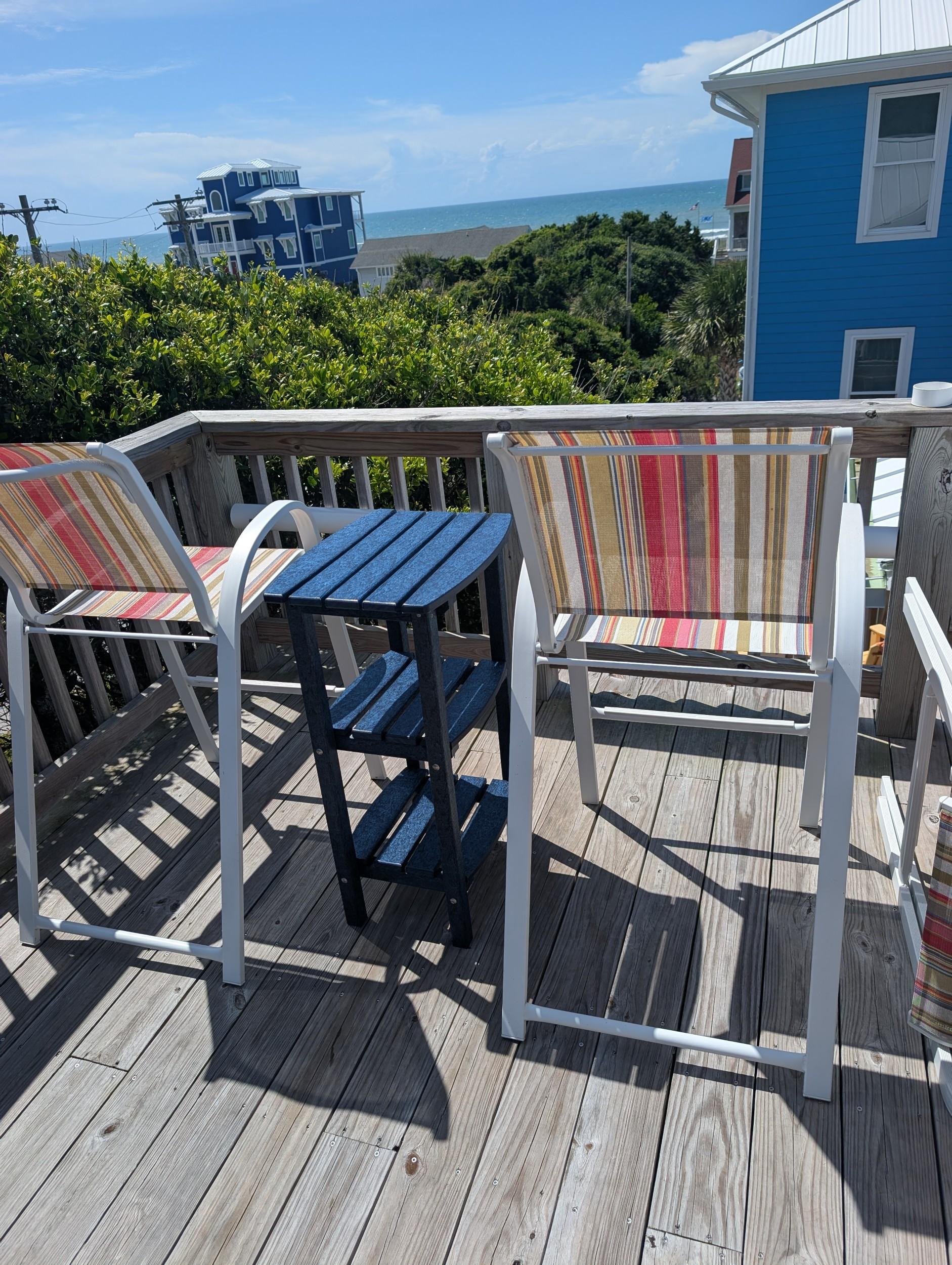 LCC-221 Patriot Blue Outdoor Side Table on deck with ocean view
