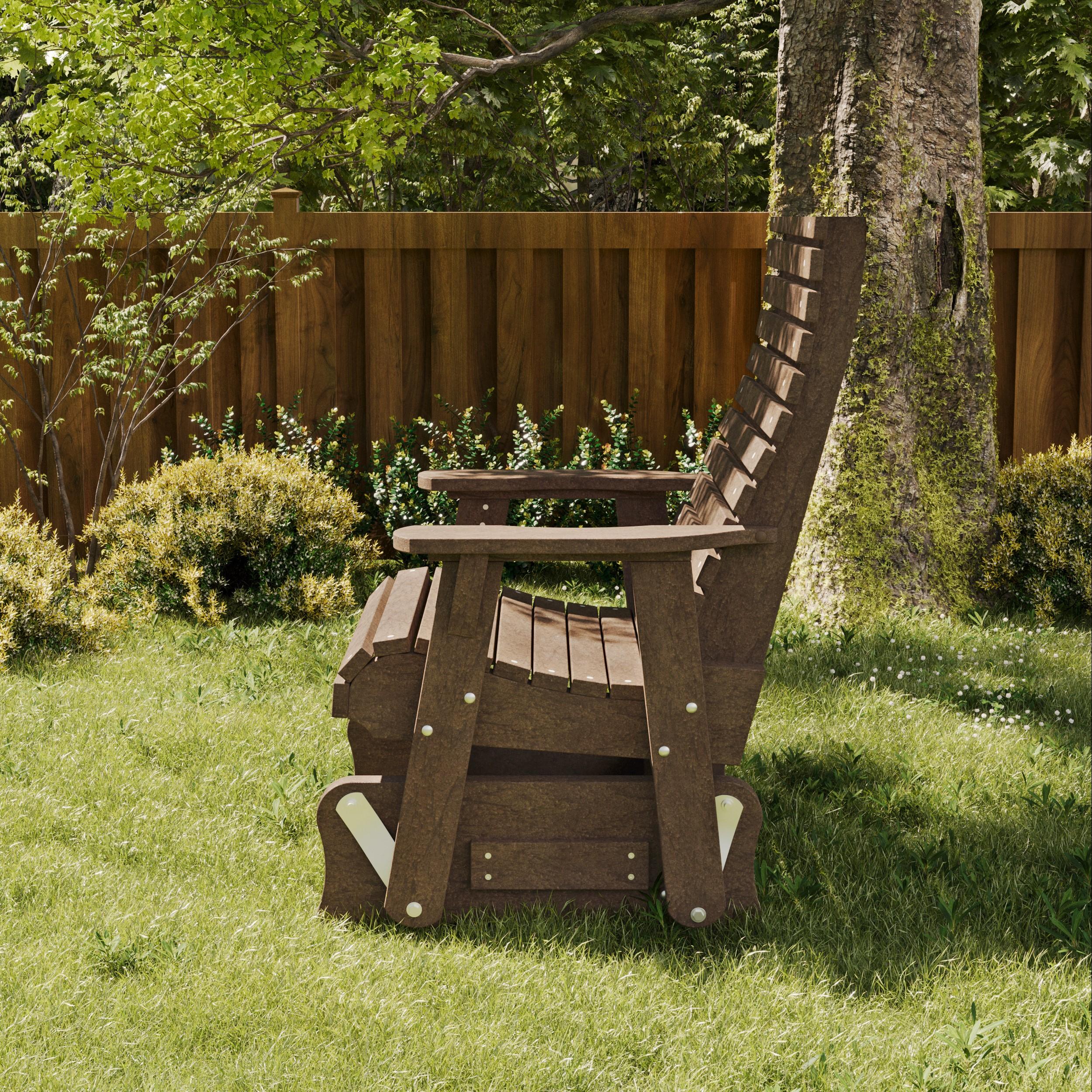 Wildridge signature brown poly outdoor glider chair on a grassy lawn near a tree and wooden fence, offering sturdy and comfortable seating.