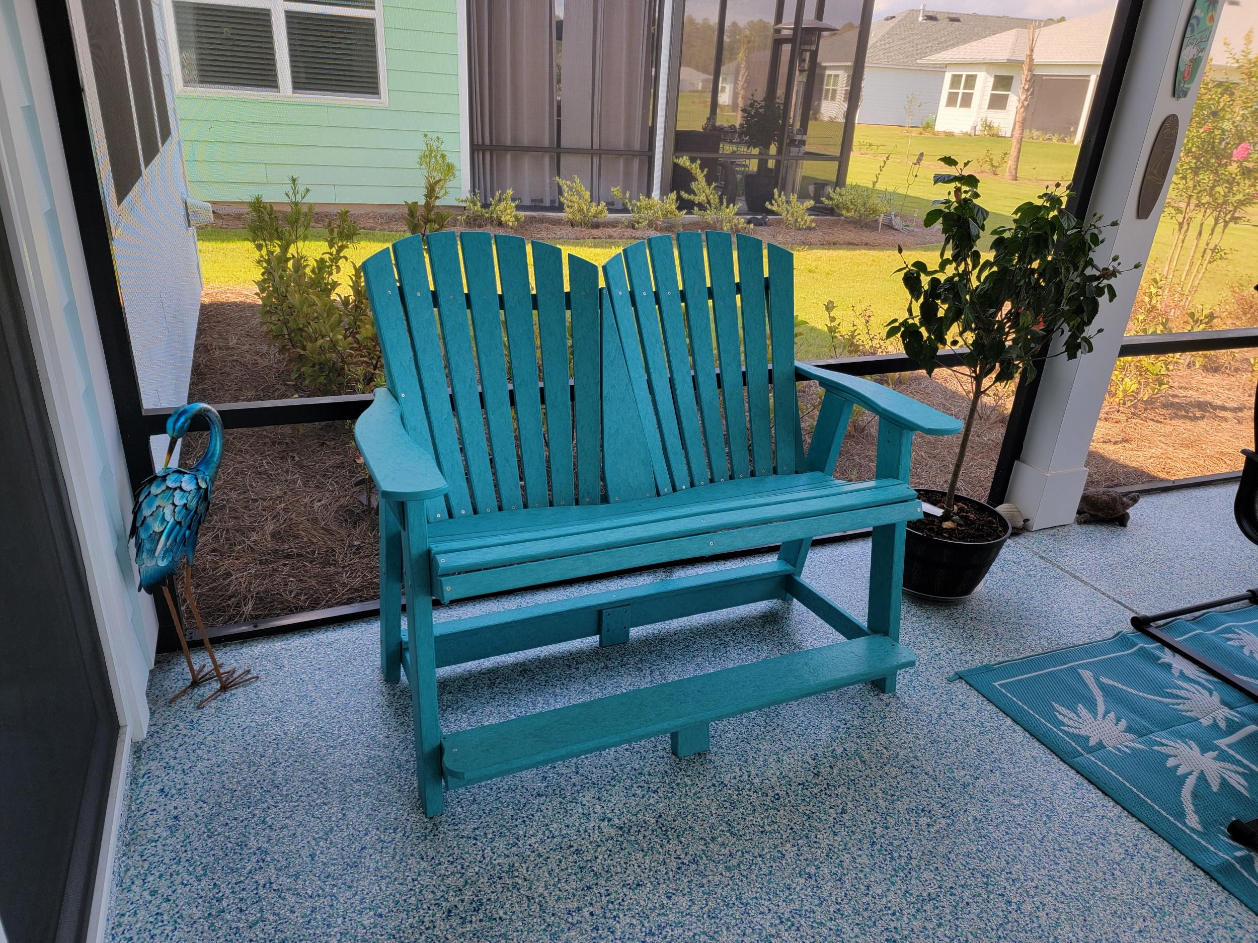 LCC-130 Heritage Double High Adirondack Chair in Aruba Blue, front view on screened porch