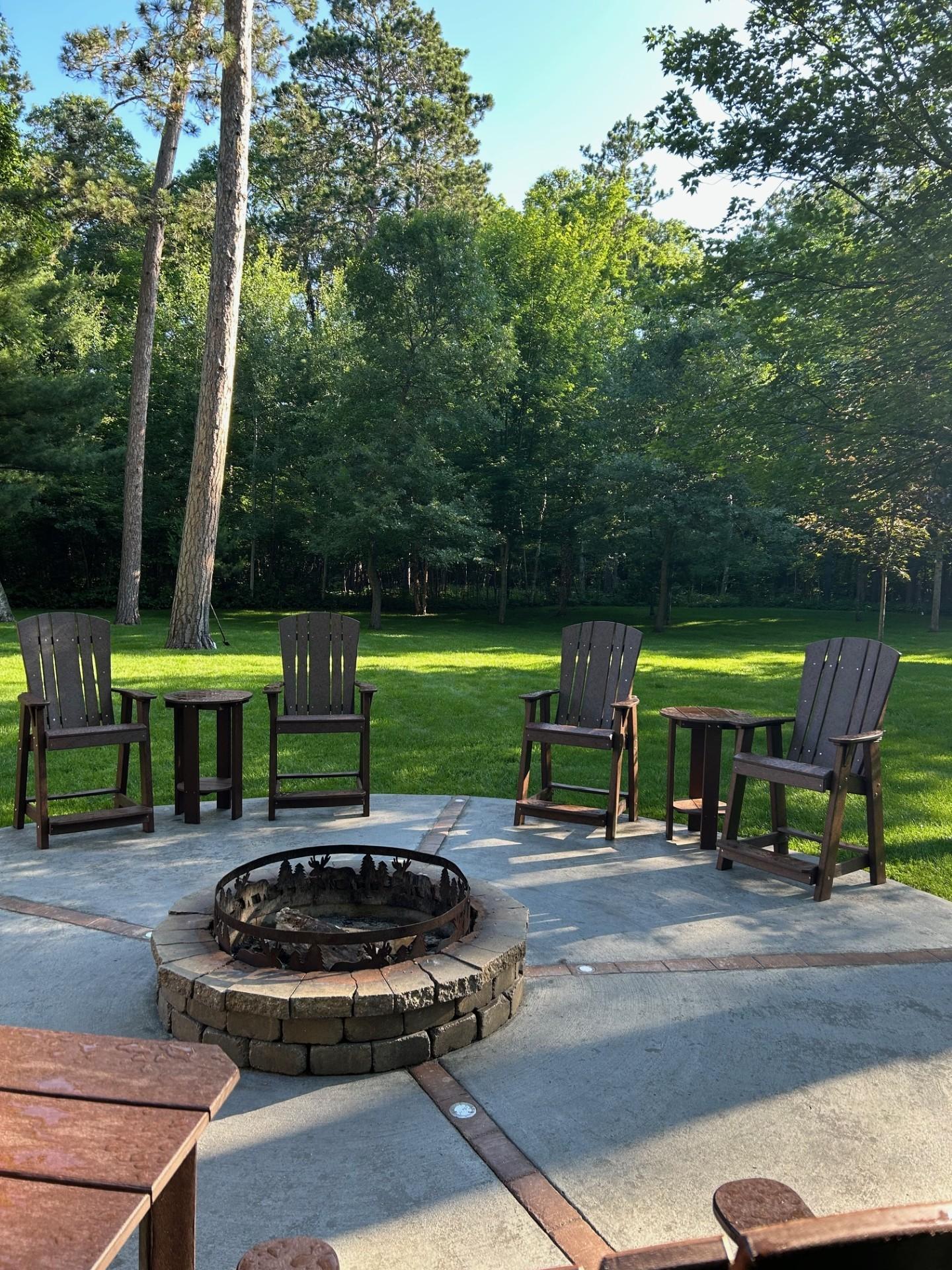 LCC-150 Heritage Balcony Chairs with LCC-152 Side Tables arranged around an outdoor firepit