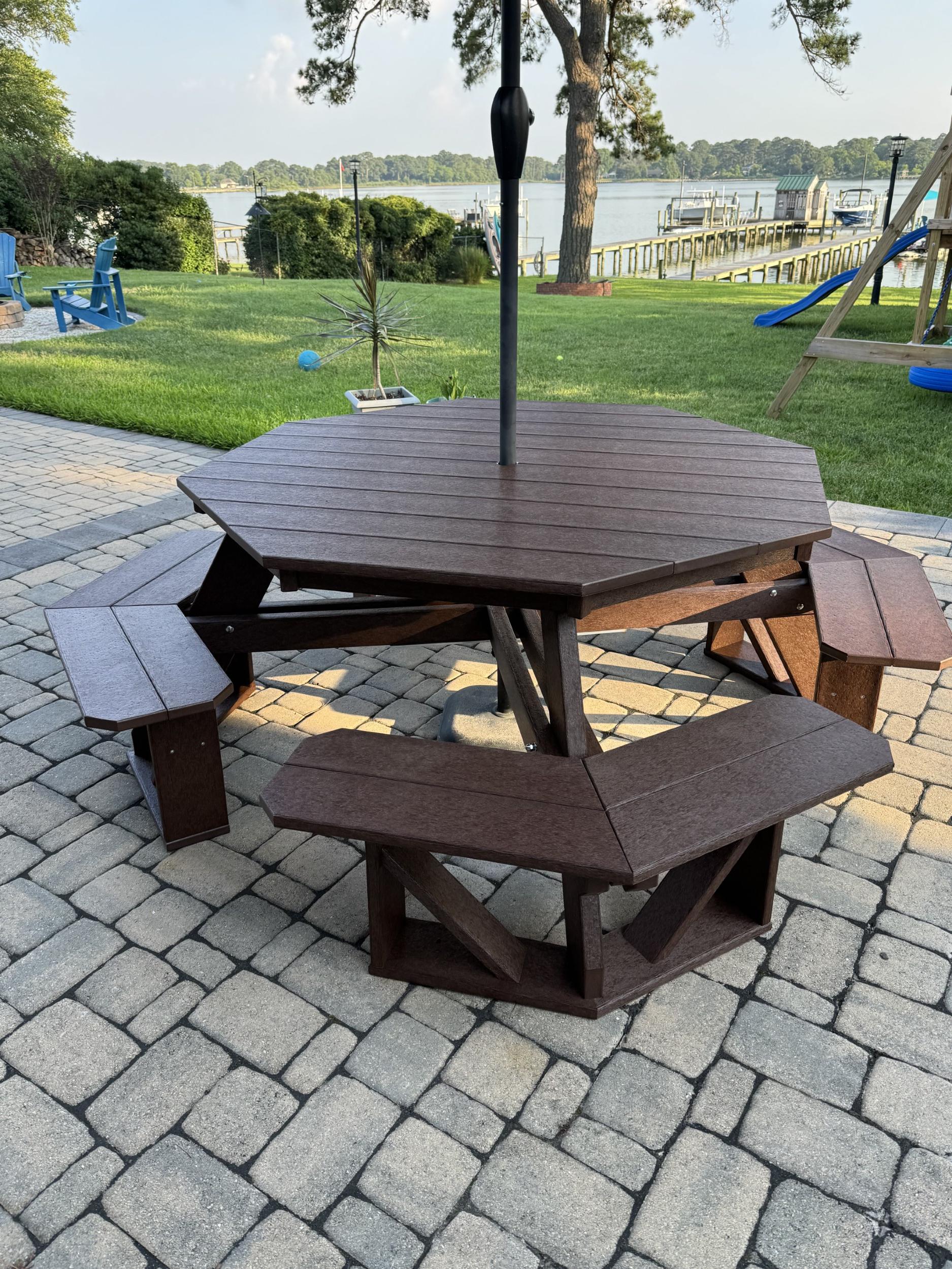 LCC-164 Heritage Octagon Picnic Table in Tudor Brown, side view on patio by waterfront