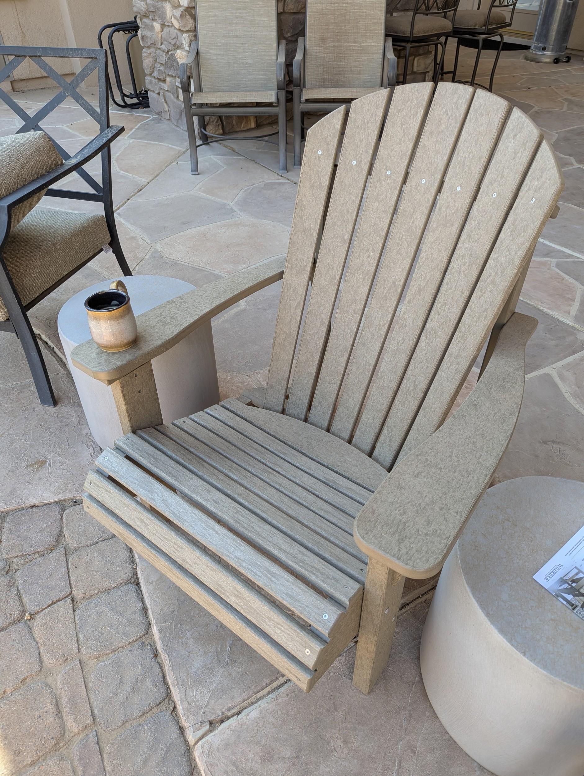Heritage Sunrise Adirondack Chair LCC-110 with wide back slats on patio.