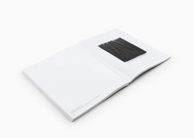 book spread with black artwork on page