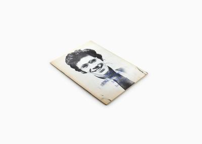 book cover with portrait of young man wearing glasses