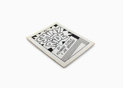 book cover with black drawing