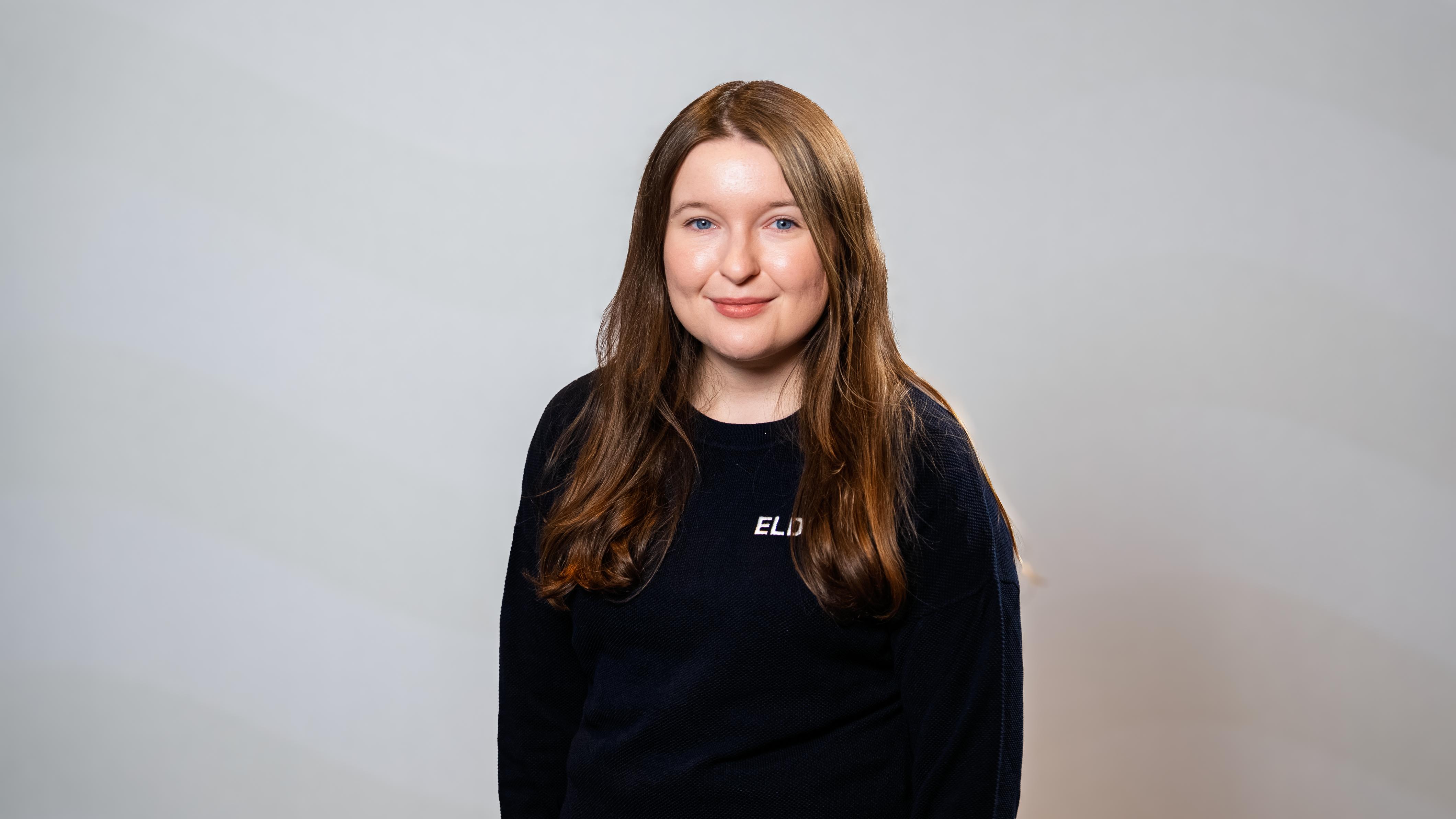Portrait photo of a women wearing ELDI sweater