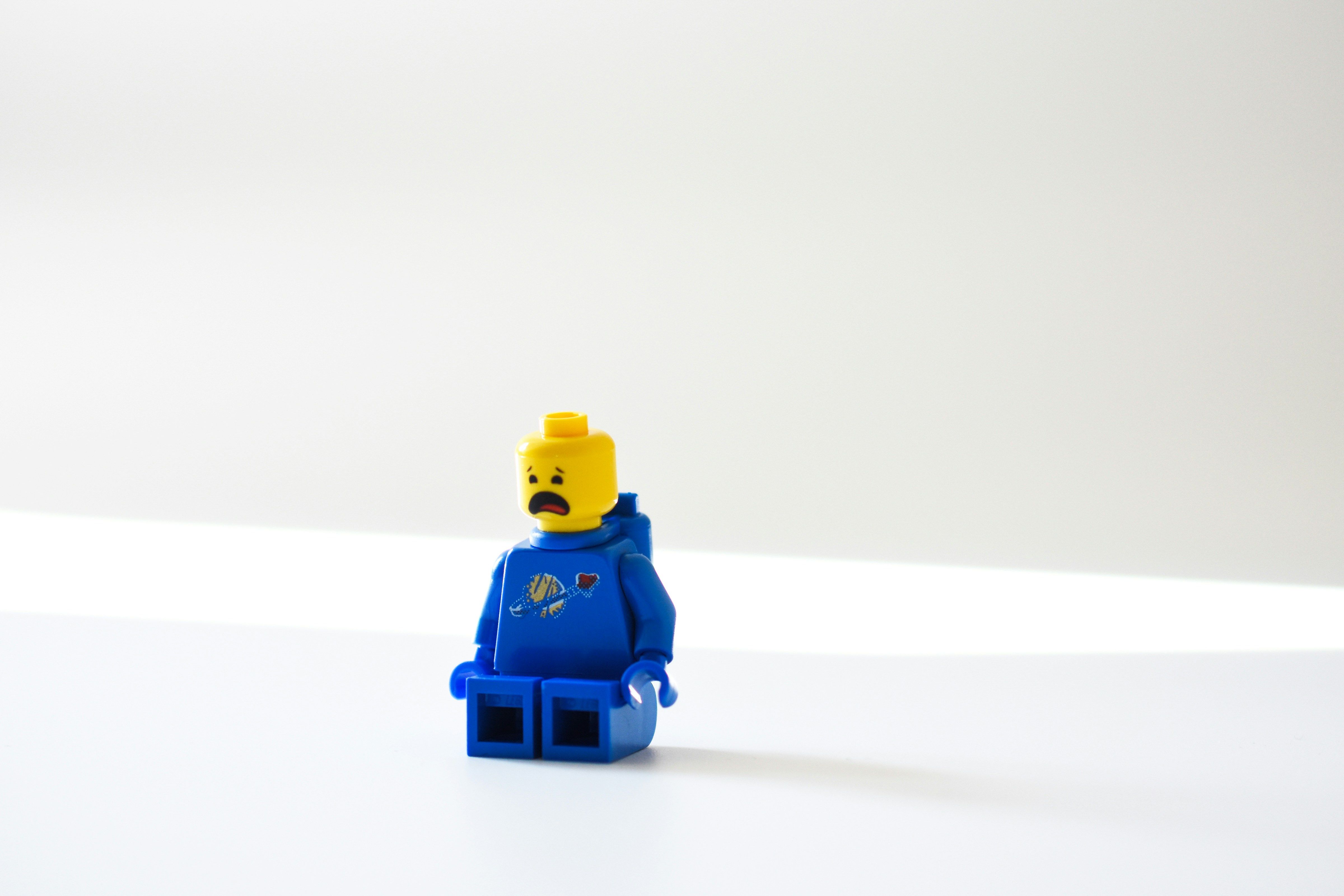 Worried LEGO character representing employees who feel they must hide their struggles at work