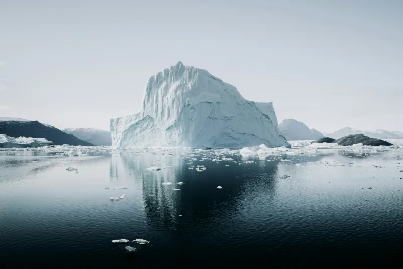 Iceberg with most of its mass hidden underwater, representing how toxic workplace culture lurks beneath visible company values