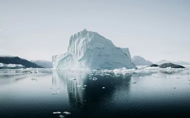 Iceberg with most of its mass hidden underwater, representing how toxic workplace culture lurks beneath visible company values