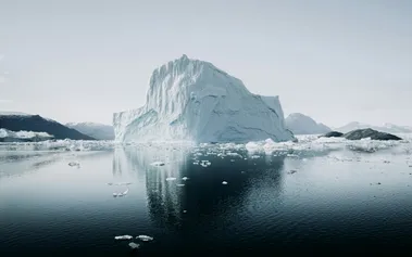 Iceberg with most of its mass hidden underwater, representing how toxic workplace culture lurks beneath visible company values